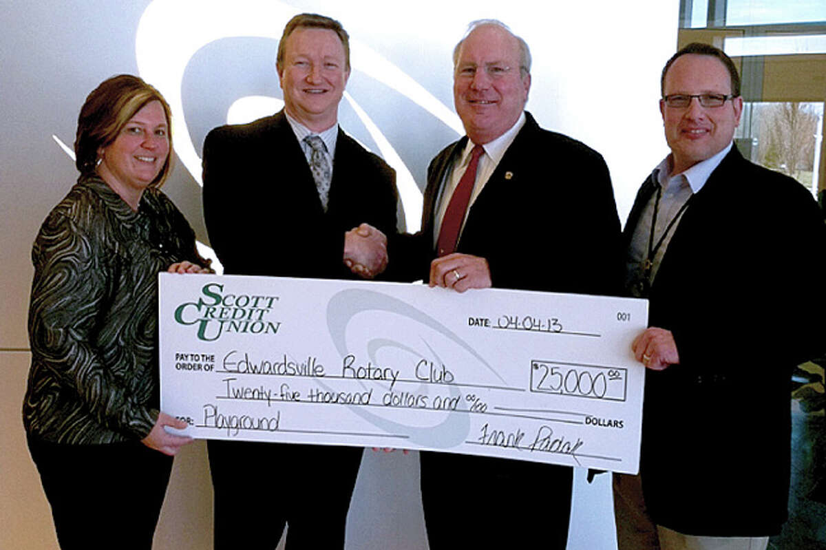 Scott Credit Union recently presented a $25,000 check to representatives from the Edwardsville Rotary to support the building of a new playground in Airplane Park. Pictured are, from left, Rotary member Ann Tosovsky, Scott Credit Union President Frank Padak, Rotary 2012-13 President Rod Vaught, and Scott Credit Union Chief Marketing Officer Adam Koishor.