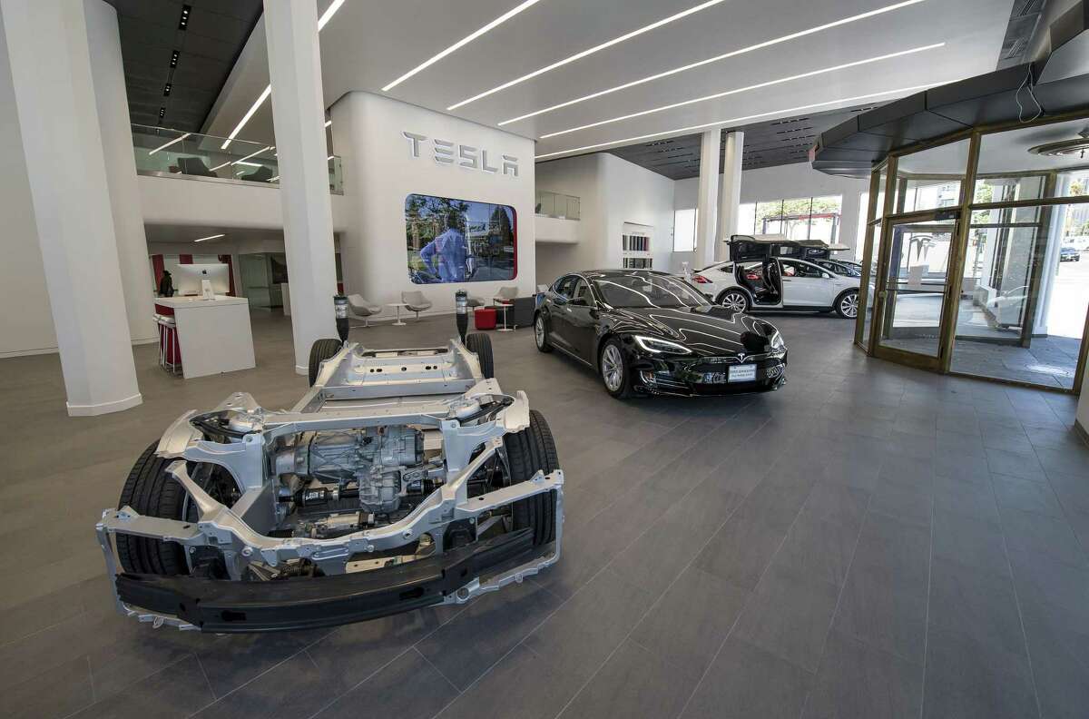 Tesla’s Model X vehicles are displayed at the company’s San Francisco showroom. Tesla briefly opened a pop-up shop at The Shops at La Cantera last year and has tried twice before to open a showroom in San Antonio.