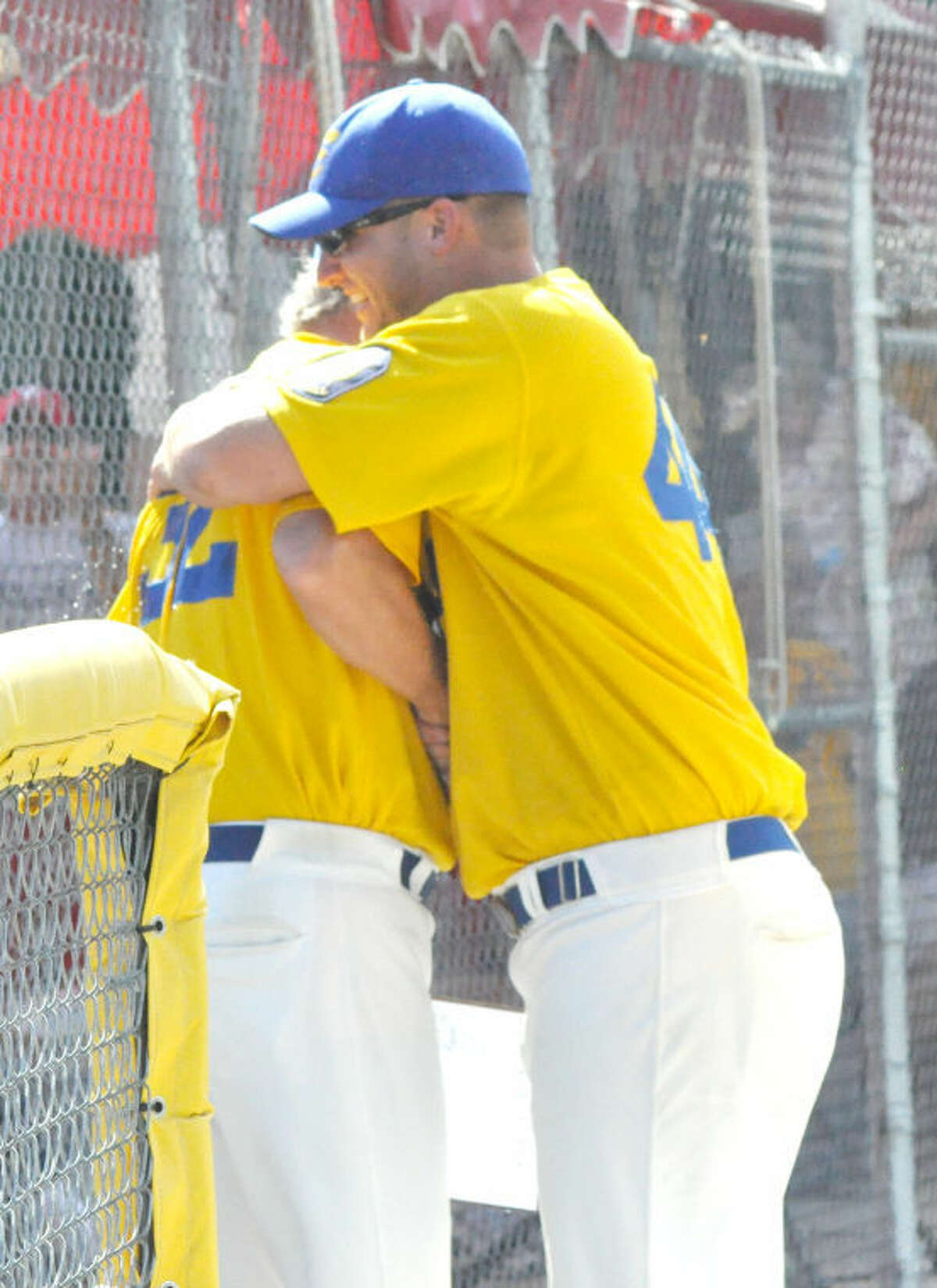 In this file photo, Post 199 pitching coach Tim Stunkel embraces head coach Ken Schaake directly after winning the state title. 