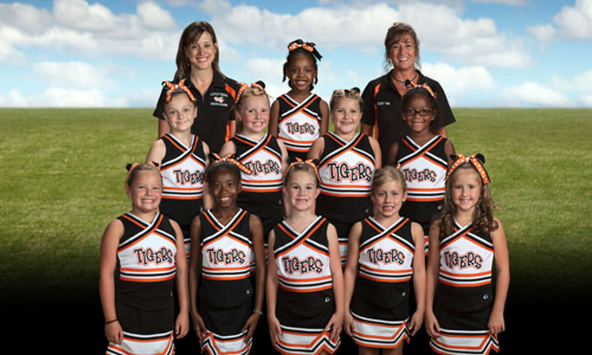 7U Little Tigers cheerleaders coached by Tina Carroll. Cheerleaders in no particular order are: Tia Thiems, Isabella Drake, Brooklyn Drake, Isabelle Manning, Barby Murry, Marcia Williams, Lauren Gander, Emma Ide, Averie Shoot and Jayden Hair.