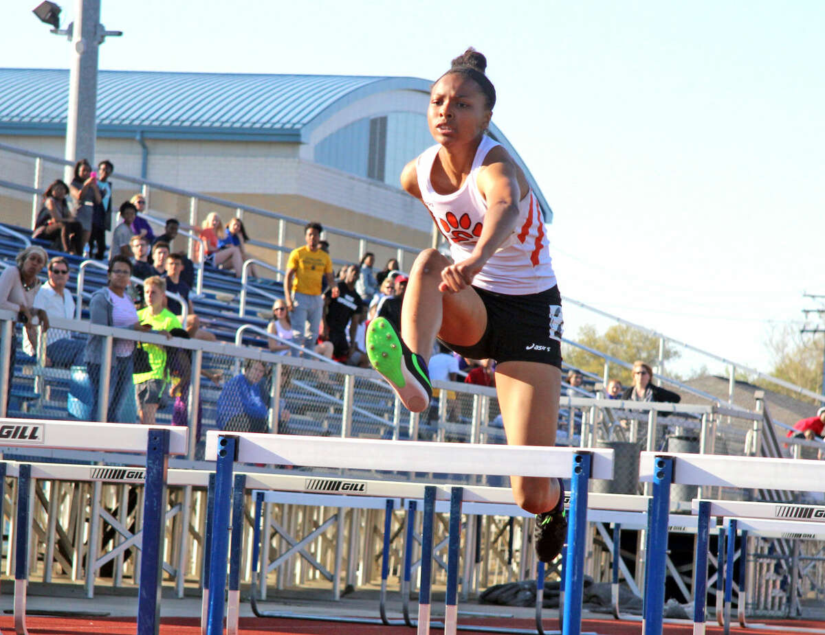 Edwardsville sophomore Kendra Griggs competes in the 100-meter hurdles during the O’Fallon Invitational on Friday.