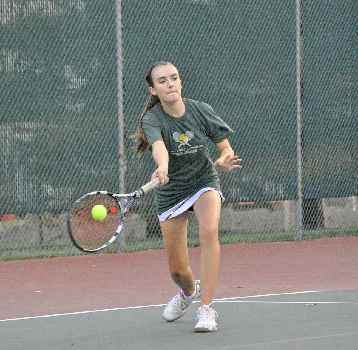 Metro’s Heather Moore-Malec returns a forehand during her No. 1 singles match against Holland.