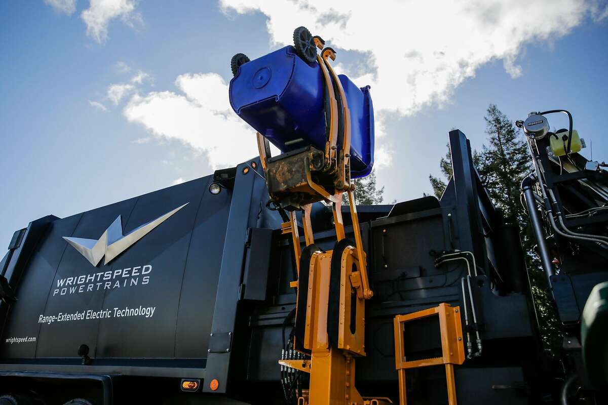 A demonstration of trash disposal is seen during a press conference to unveil Wrightspeed's new hybrid dump truck, in Santa Rosa, California, on Tuesday, Nov. 1, 2016.