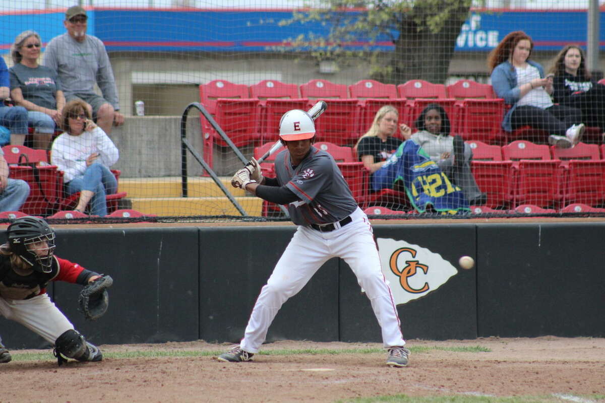 EHS junior Mark Smith starts his swing at a pitch during Tuesday’s game against Granite City. 