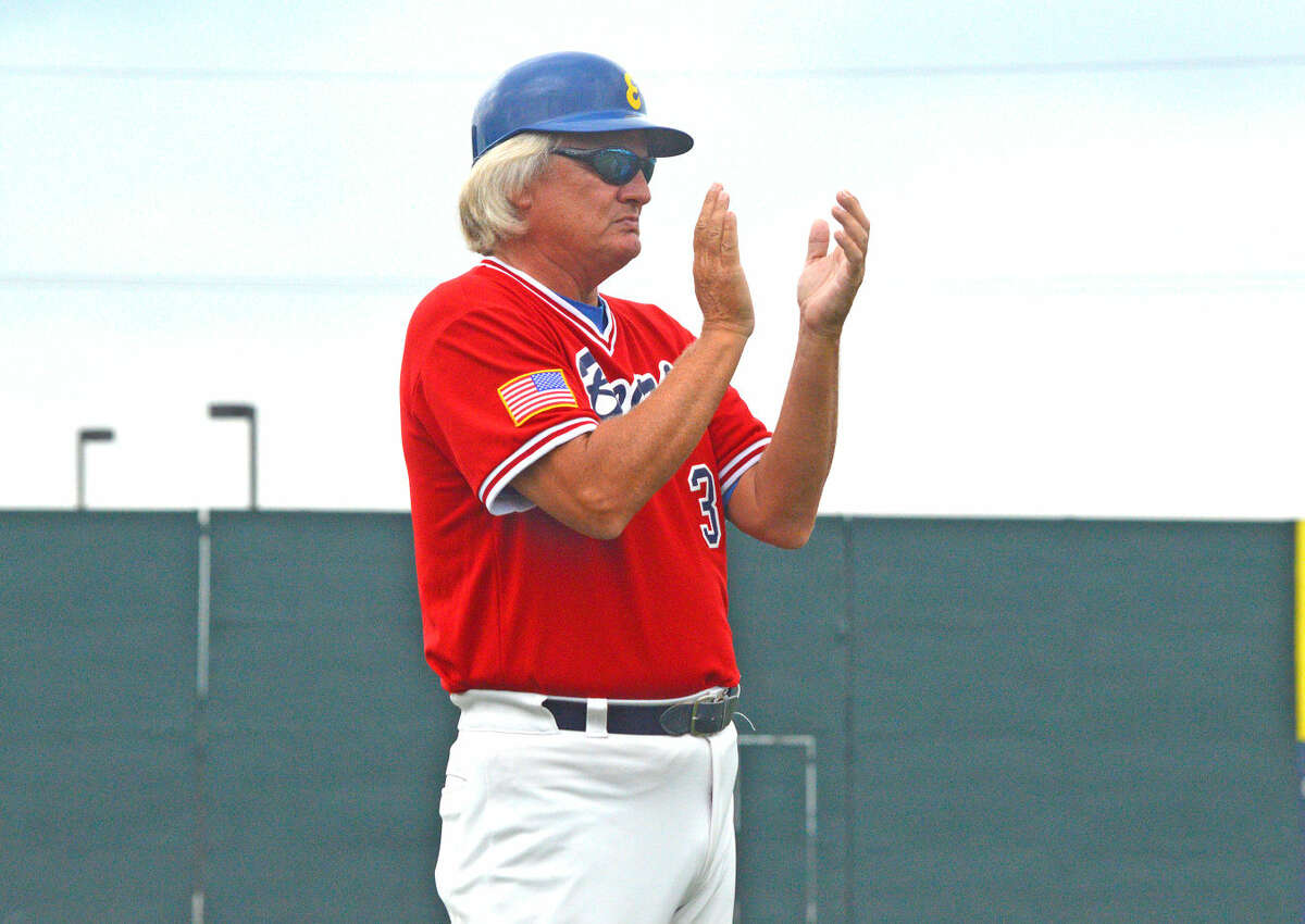 In this file photo, Metro-East Bears manager Ken Schaake encourages his team while coaching from third base during the second inning of a first-round game against Rockport, Ind., in the American Legion Great Lakes Regional at GCS Ballpark in Sauget.
