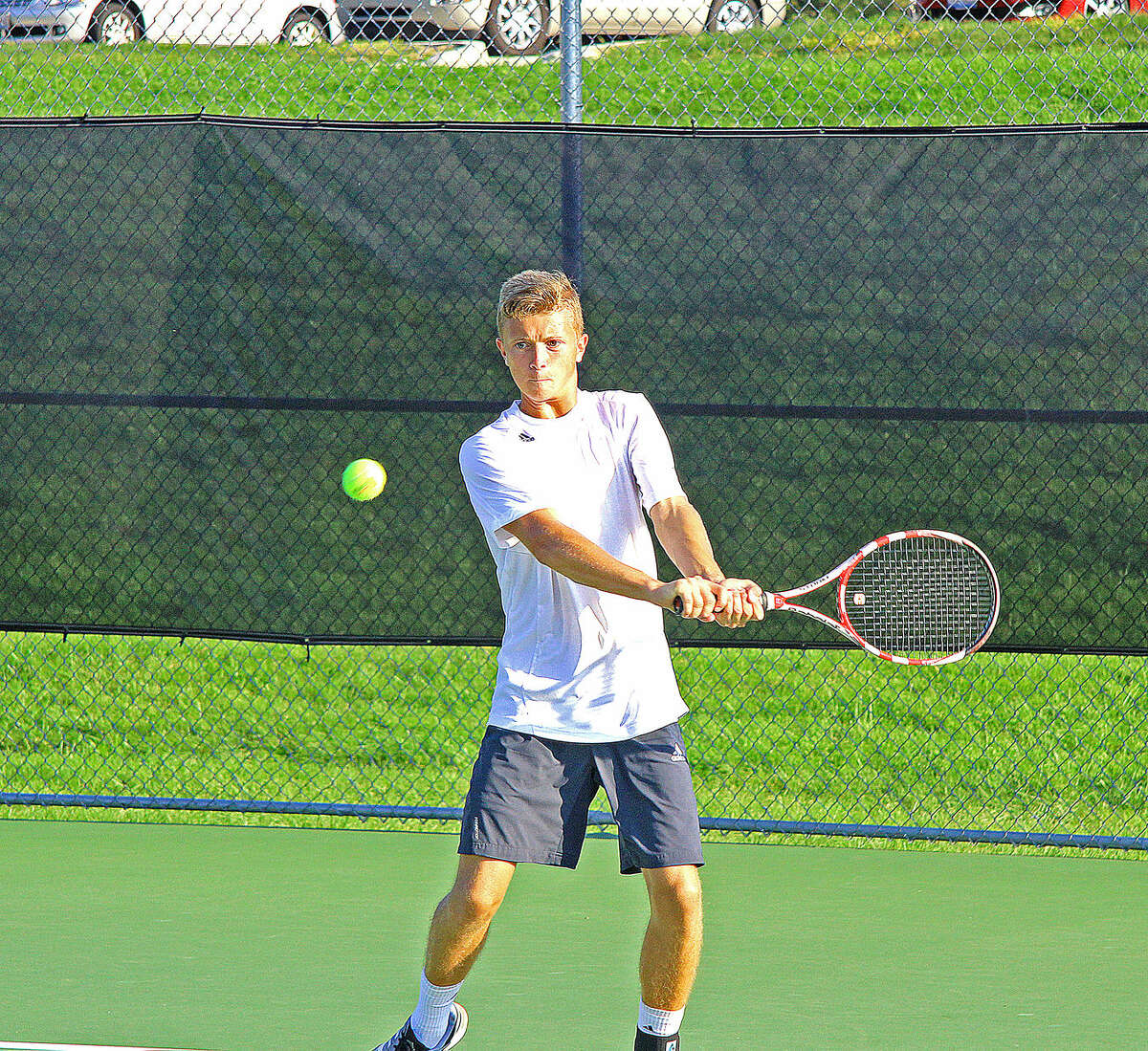 Former Edwardsville player Jack Desse, a freshman at SIUE, returns a shot Friday during a doubles match at SIUE Fall Invitational.