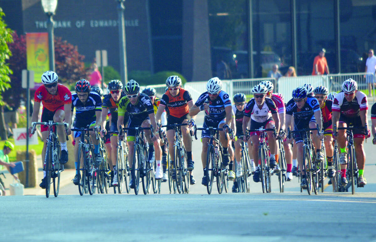Cyclists travel toward Main Street and the final turn of the The Bank of Edwardsville Rotary Criterium on Saturday. 