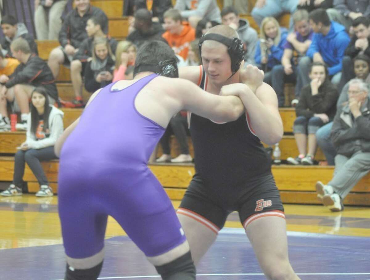 Edwardsville heavyweight Sab Champlin looks for positioning against Collinsville’s Drew Pikey Thursday in Collinsville. 