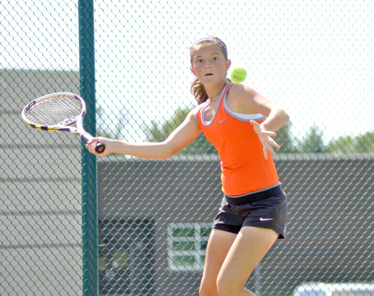 EHS freshman Grace Desse hits a forehand Saturday at Liberty Middle School in her No. 2 doubles match with partner Emma Lipe against Normal in the Southern Illinois Duals. 