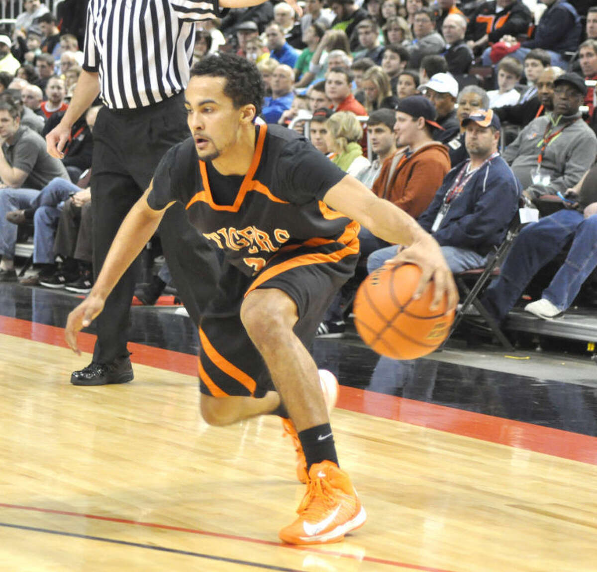 Tre Harris looks for an opening from the perimeter at the 2012-13 Class 4A state tournament.