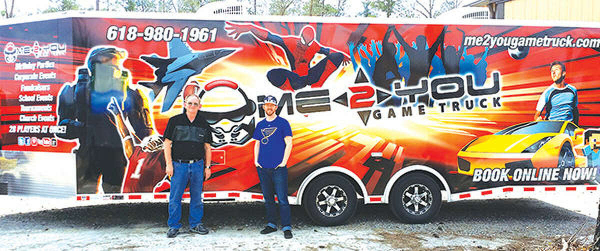 Granite City resident Wayne Felix’s (right) business, the Me 2 You Game Truck, is a truck that travels driveway to driveway providing entertainment for up to 28 guests. Left of Felix is his father, Dennis Felix.