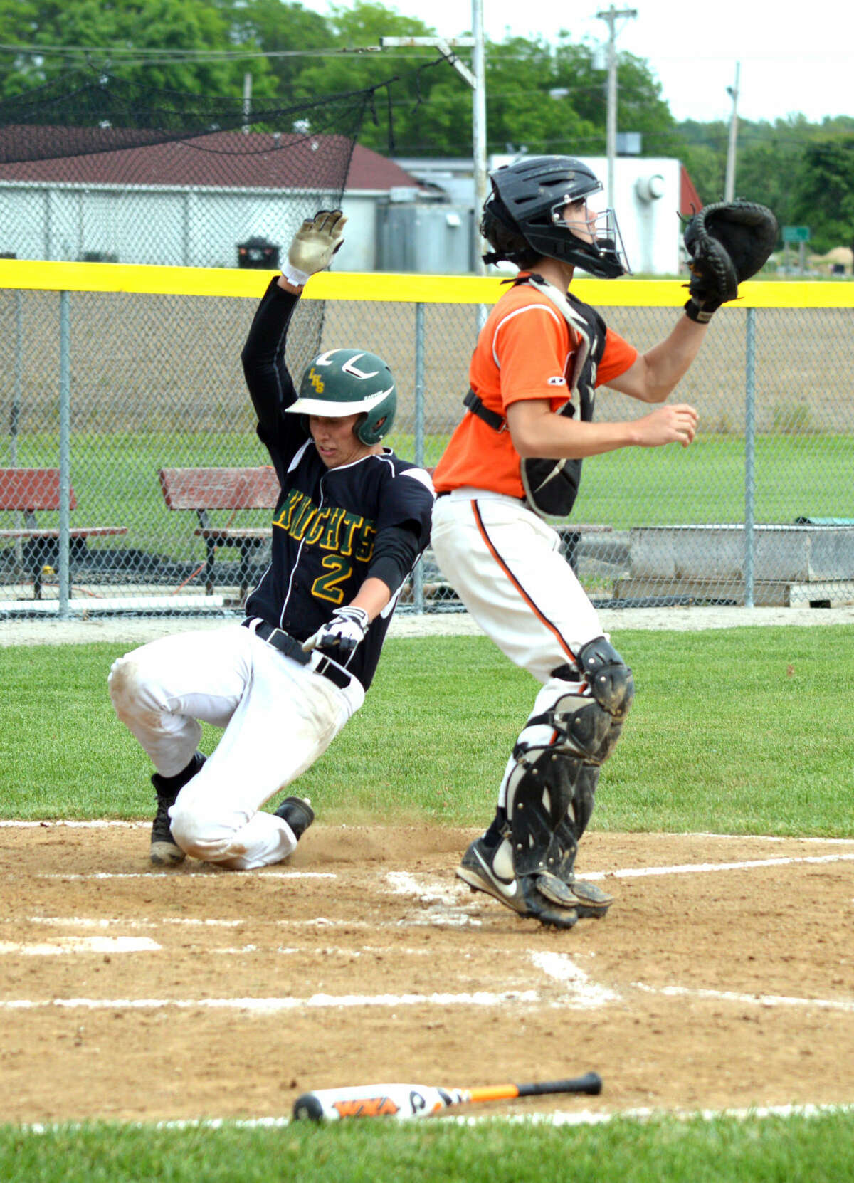 Metro junior Mikey Coulson scores a run in the second inning.