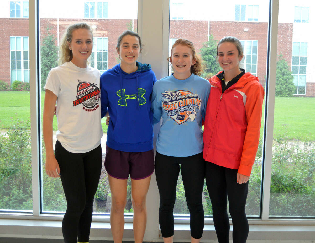 Edwardsville’s state-bound 3,200-meter relay team consists of (from left) Danielle Bohannon, Maddie Miller, Victoria Vegher and Lorie Cashdollar.