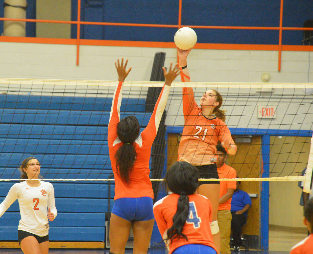 Edwardsville sophomore Rachel Pranger goes up for a kill during Thursday’s Southwestern Conference match at East St. Louis. 