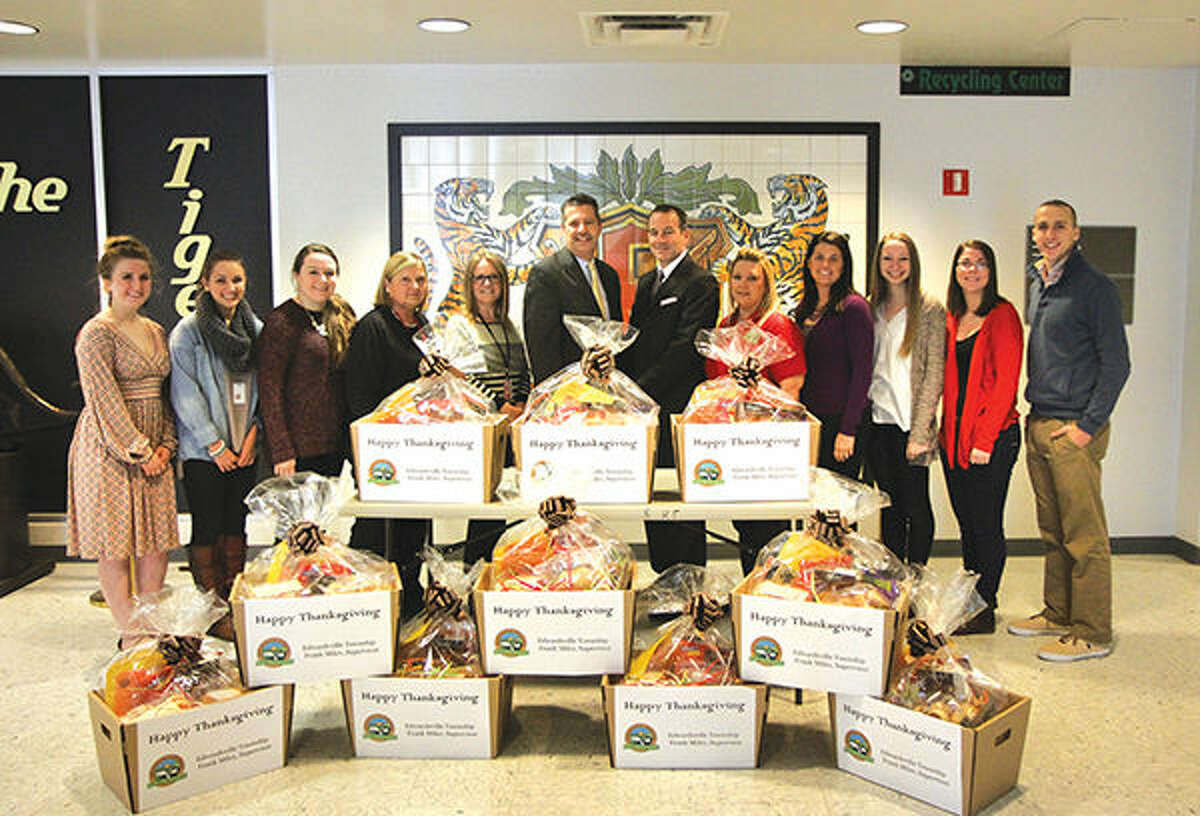 Edwardsville Township Supervisor Frank Miles presents Thanksgiving baskets to EHS Principal Dennis Cramsey, Student Council Advisor Melissa Beck, and members of the EHS Student Council.  From left are: Isabella Lilley, Cassie Patrick, Taylor Tarter, Pam Harmon, Mrs. Melissa Beck, EHS Student Council Advisor; Mr. Frank Miles, Edwardsville Township Supervisor; Dr. Dennis Cramsey, EHS Principal; Christine Doty, Edwardsville Township Community Outreach; Mrs. Jeanne Wojcieszak, Edwardsville Township Administrator; Katie Frick, EHS Student Council President; Nina Weatherly, and Shawn Semmler.