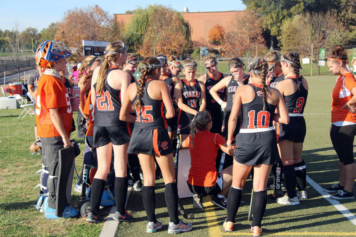 Edwardsville coach Julia Tyler talks to her team during a timeout in Tuesday’s regular-season finale at MICDS.