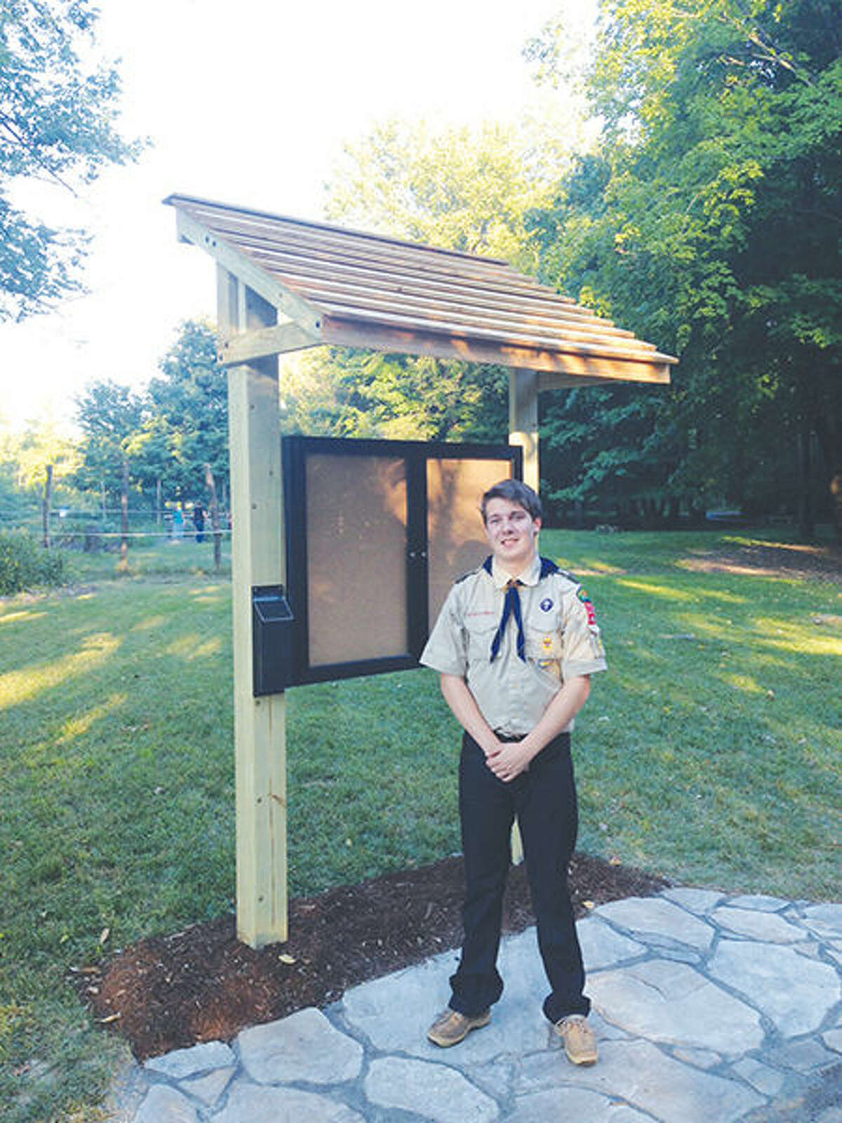 Eagle Scout Bryan Dammerich, of Glen Carbon, stands with his completed project at the Gardens at SIUE.