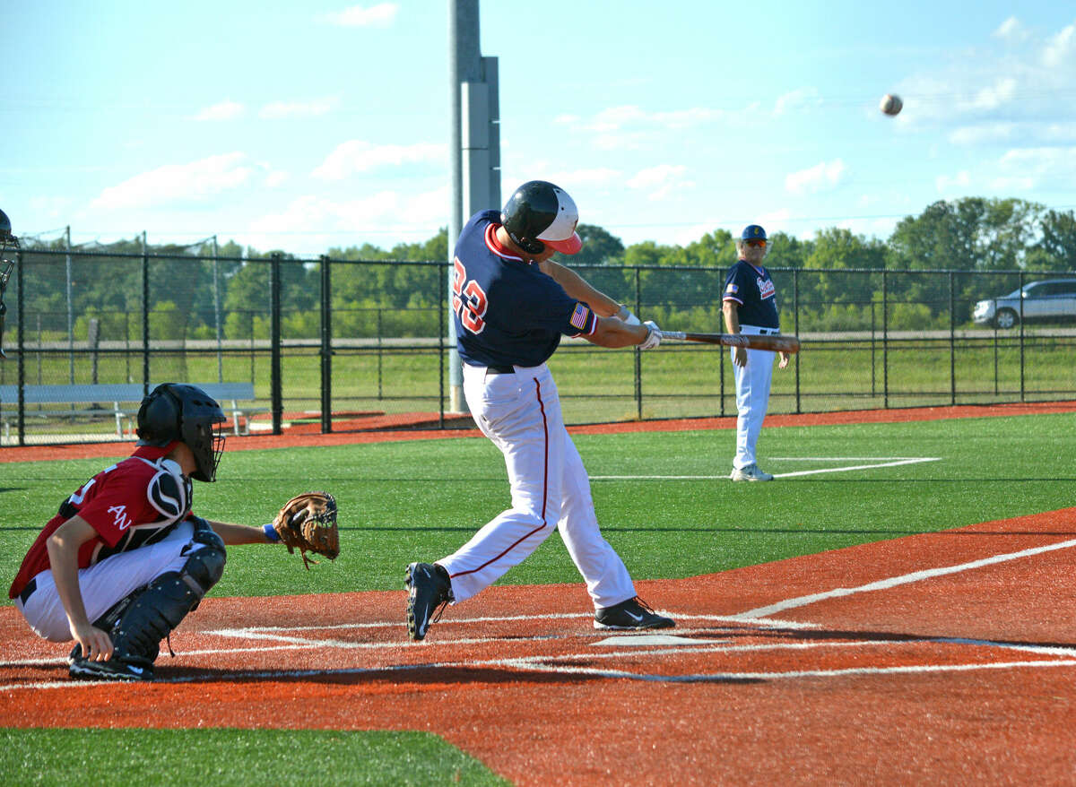 Jake Garella of the Edwardsville/Alton Bears connects with a pitch during the first inning of Tuesday's game against American National at SIUE.