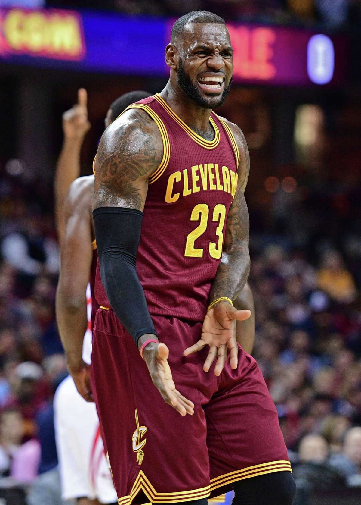 Cleveland Cavaliers forward LeBron James disputes a call with the referee during the first half of an NBA basketball game Tuesday, Nov. 1, 2016, in Cleveland. (AP Photo/David Dermer)