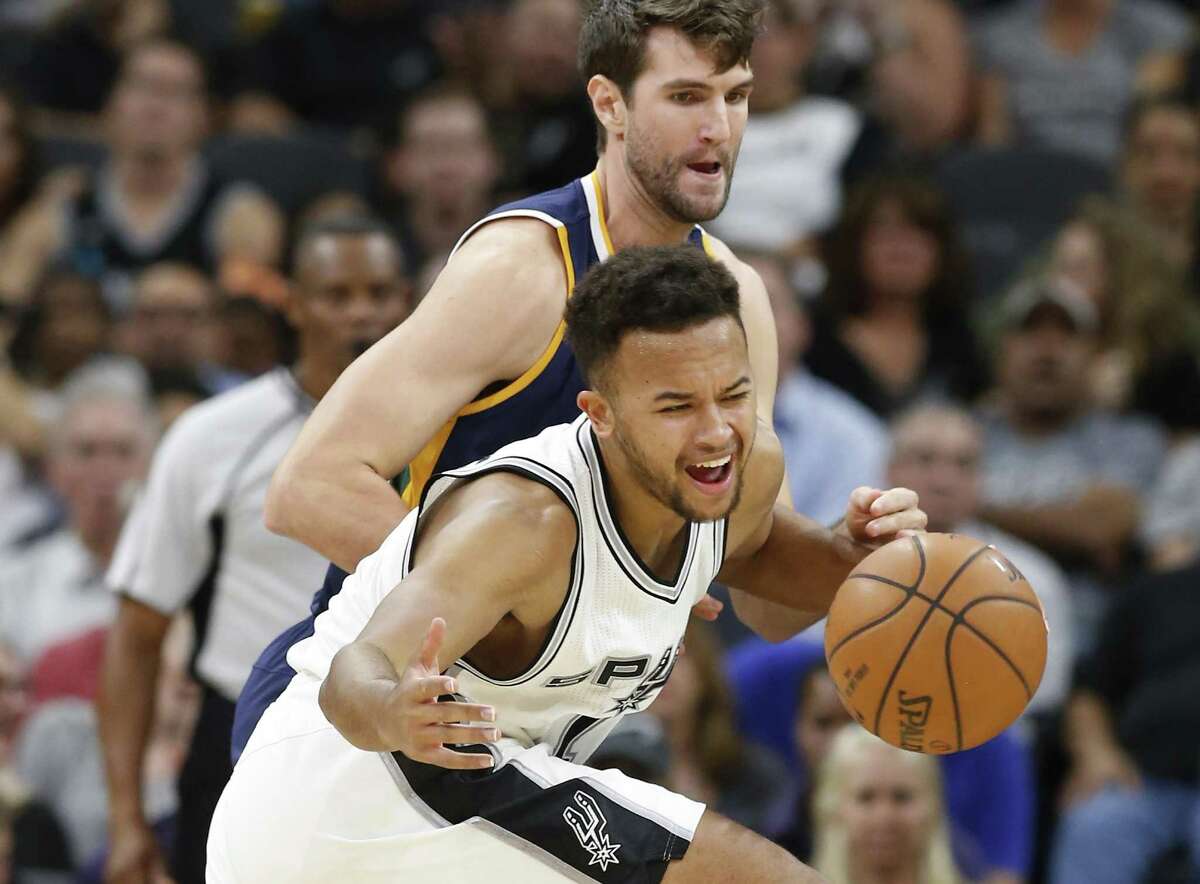 Spurs’ Kyle Anderson loses control of the ball against the Utah Jazz’s Jeff Withey during the game at the AT&T Center on Nov. 1, 2016.