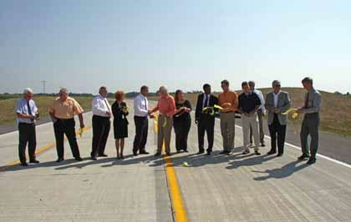 The ribbon-cutting for Governors' Parkway in August 2009, the spur that enables drivers to get quickly from Interstate 55 to SIUE and passes through a retail corridor of Edwardsville and Glen Carbon. Madison County officials have asked Edwardsville to take over the rest of the parkway that is not owned by Glen Carbon. 