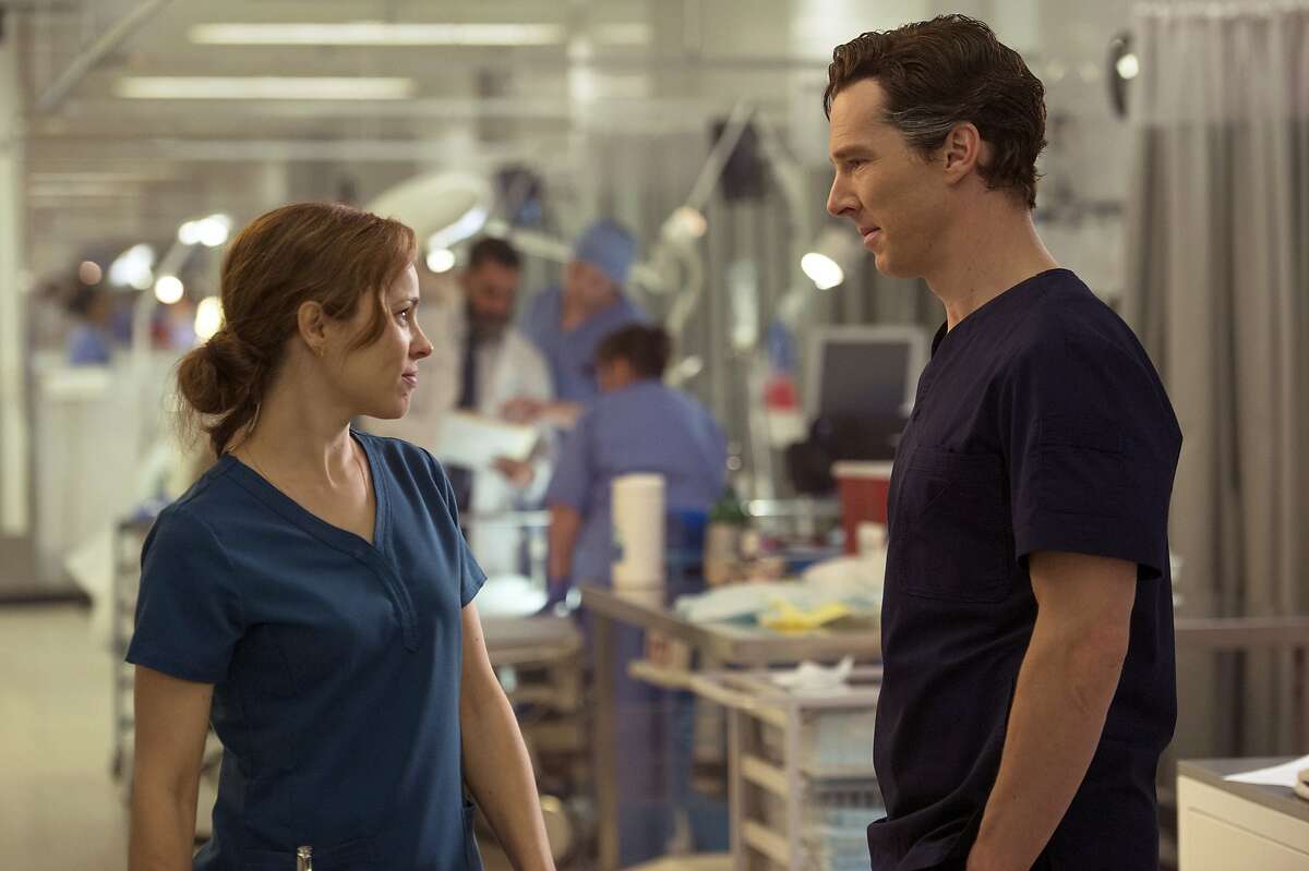 This image released by Disney shows Rachel McAdams, left, and Benedict Cumberbatch in a scene from Marvel's "Doctor Strange." ( Jay Maidment/Disney/Marvel via AP)