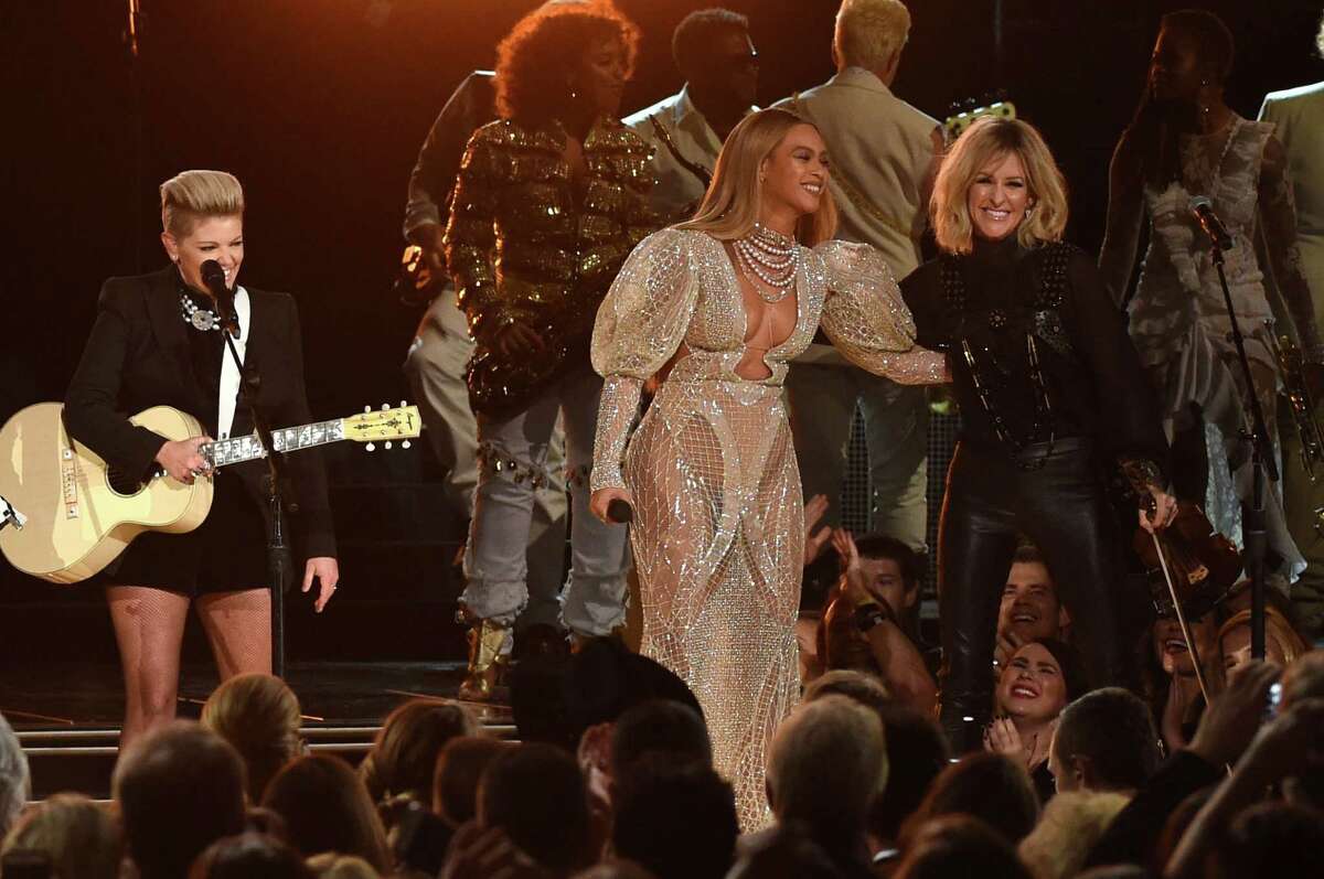 Beyonce performs with the Dixie Chicks at the 50th annual CMA Awards at the Bridgestone Arena in Nashville on Wednesday.