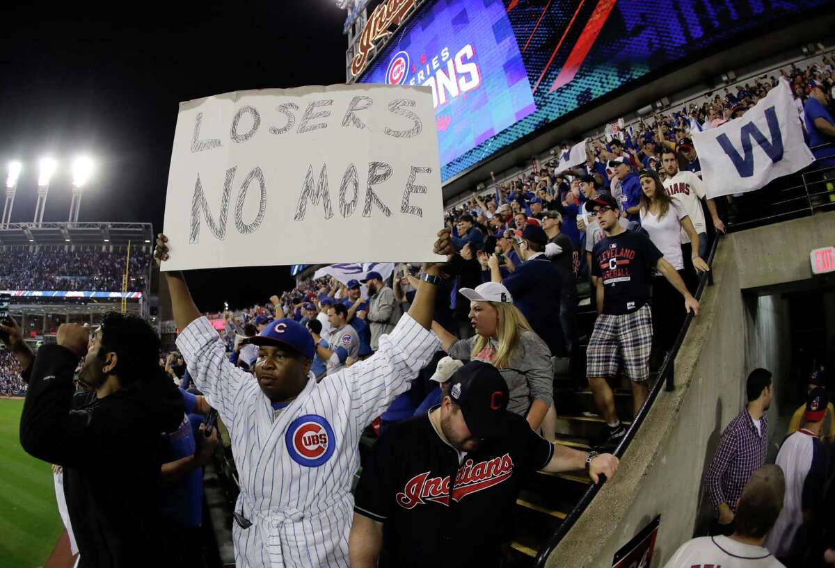 Fan react after the Chicago Cubs won Game 7 of the Major League Baseball World Series against the Cleveland Indians Thursday, Nov. 3, 2016, in Cleveland. The Cubs won 8-7 in 10 innings to win the series 4-3. (AP Photo/Charlie Riedel)
