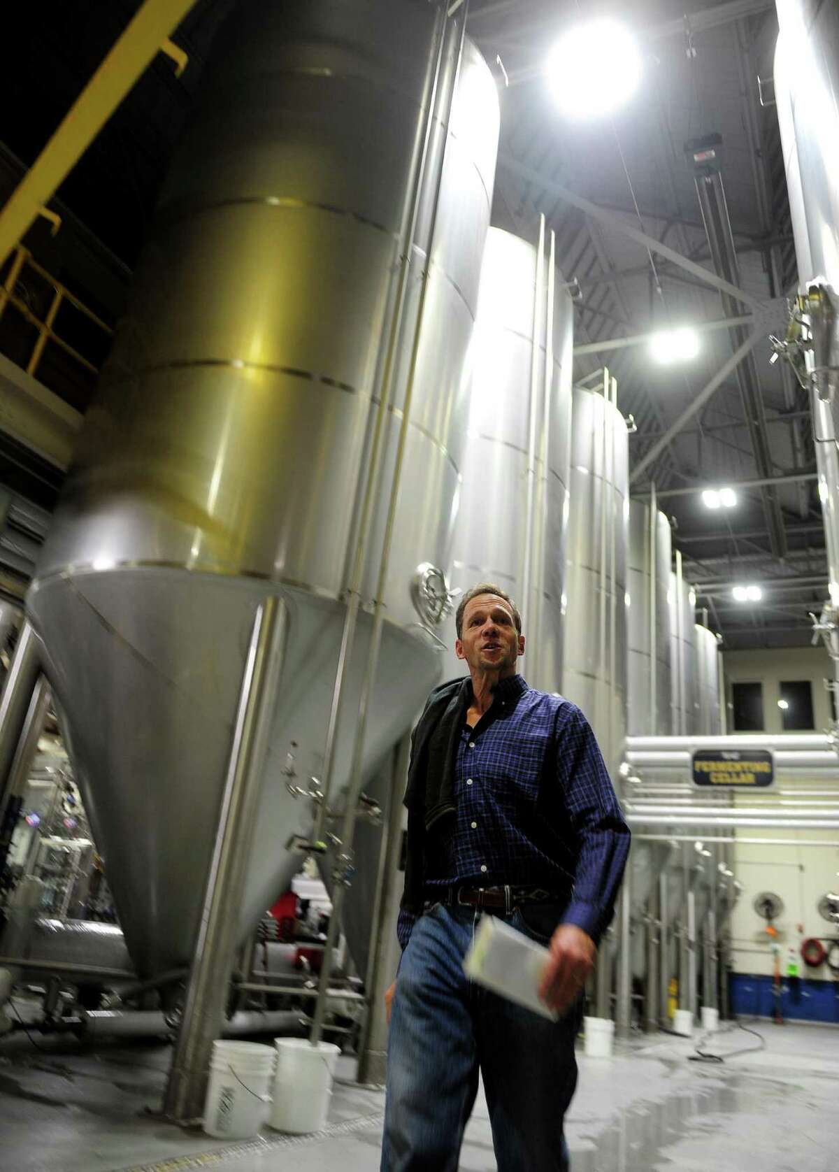 Two Roads Brewery CFO Peter Doering shows the brewery's new energy efficient LED lights have recently been installed on Stratford Avenue in Stratford, Conn. on Wednesday Nov. 2, 2016. The new lights, installed by Digital Lumens, are state-of-the-art, can be controlled via WiFi or from a central computer and have motion sensors.