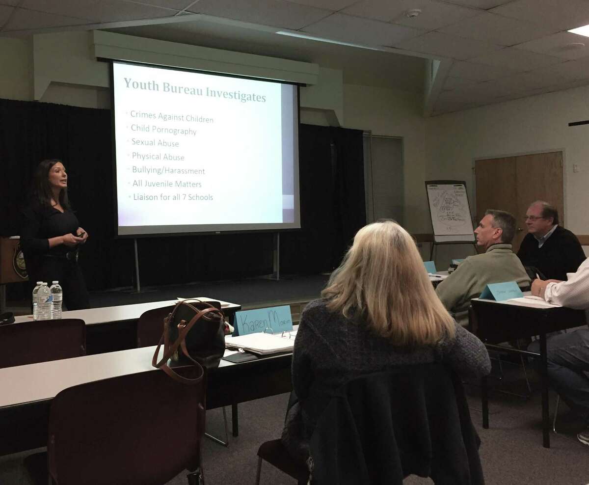Sgt. Sereniti Dobson presents on the police's Youth Bureau during the eighth week of the Westport, Conn. Citizens' Police Academy on Oct. 27, 2016.