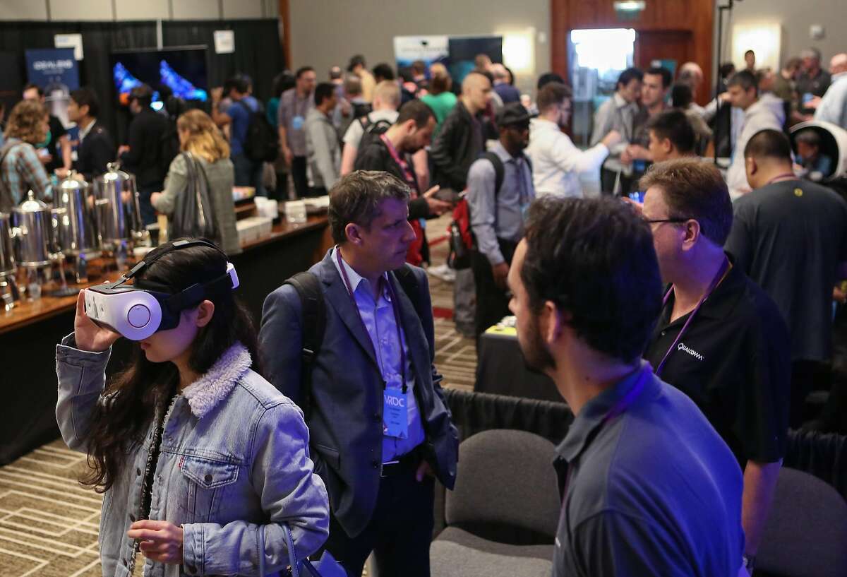 Attendees and exhibitors at the Virtual Reality Developers Conference on Thursday, Oct 3, 2016 in San Francisco, Calif.