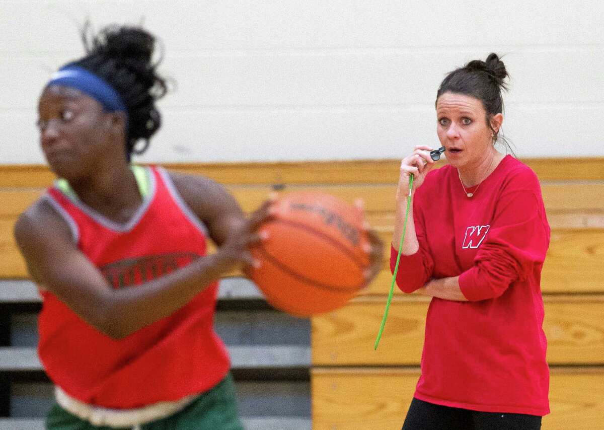 The Woodlands head coach Trista Tastch watches players during drill at The Woodlands High School Thursday, Oct. 27, 2016, in The Woodlands. Tastch, who has been an assistant girls basketball coach at The Woodlands for 17 years, takes over for Dana Bruton, who retired after 11 seasons as head coach.