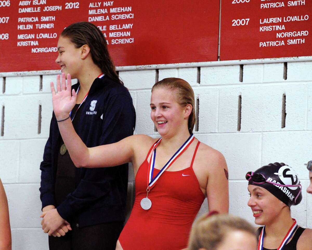 Kelly Montesi of Greenwich smiles and waves as she received her medal for a second place finish in the 200 IM event during the FCIAC Girls Swimming Championship at Greenwich High School, Conn., Thursday, Nov. 3, 2016.