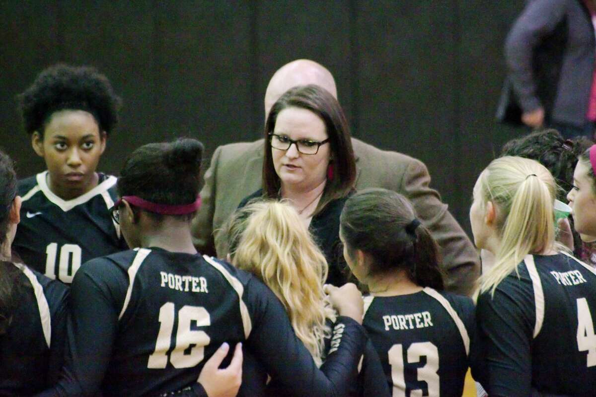 Porter volleyball coach Ashley Tiernan speaks to her team during a break against Manvel Thursday, Nov. 3 at Pasadena Memorial High School.