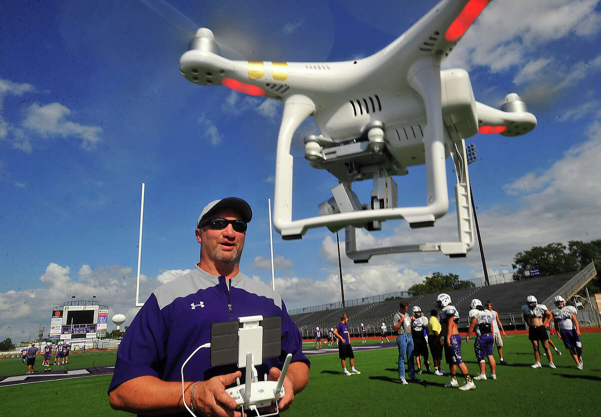 Port Neches-Groves assistant football coach Brian Cates has been using a drone to capture practice plays from a an angle that could prove beneficial to improving team performance. While still not widely used by most high schools, drone footage is poised to be the next technological innovation embraced by coaches looking for new ways to elevate their game. Photo taken Thursday, November 3, 2016 Kim Brent/The Enterprise