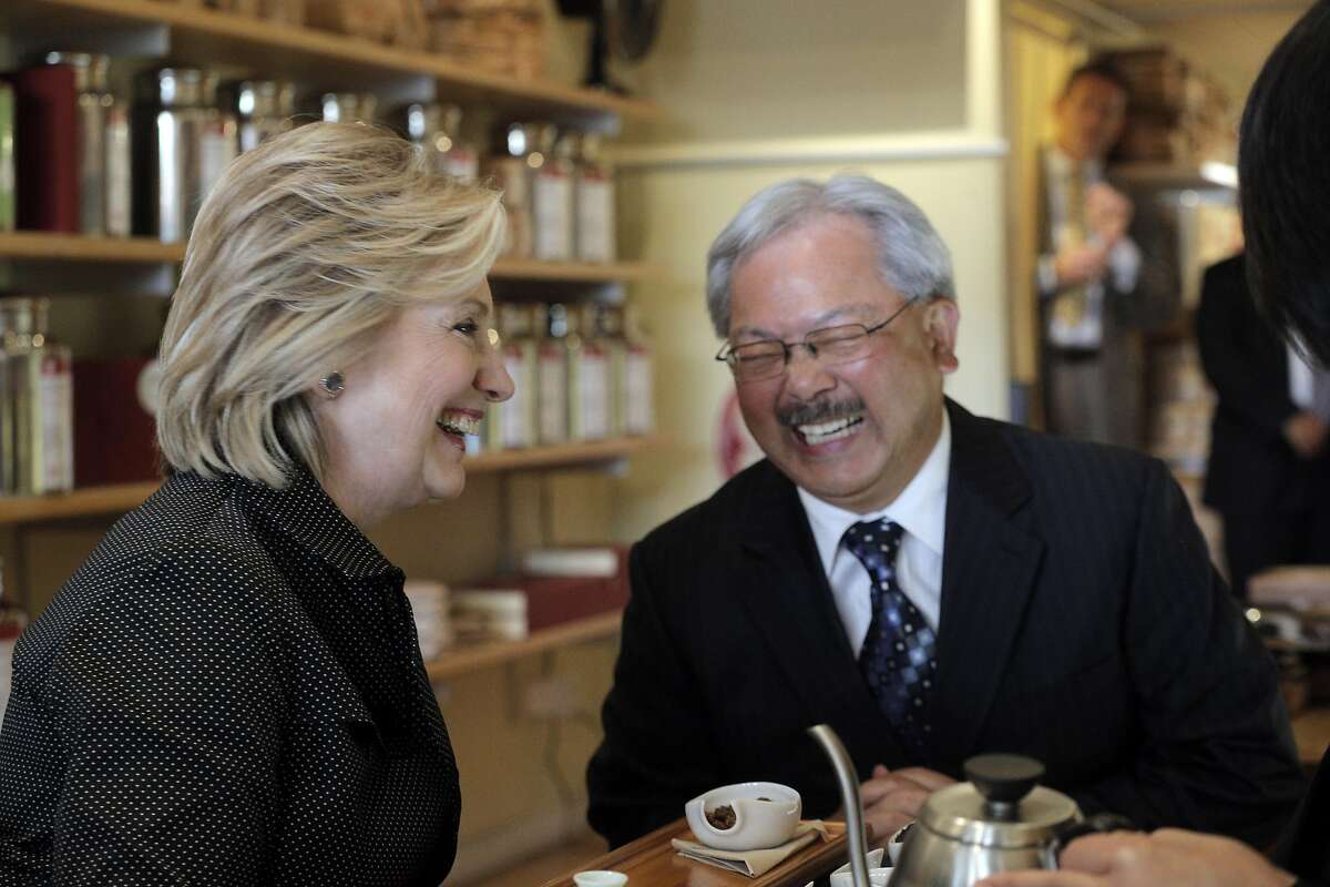 Hillary Rodham Clinton, left, and Mayor Ed Lee, laugh as they and Alice Luong, right, owner of Red Blossom Tea Company share tea at Red Blossom Tea Company in San Francisco on Wednesday. Former Secretary of State Hillary Rodham Clinton visited with Mayor Ed Lee to discuss problems specific to the city in San Francisco, Calif., on Wednesday, May 6, 2015.