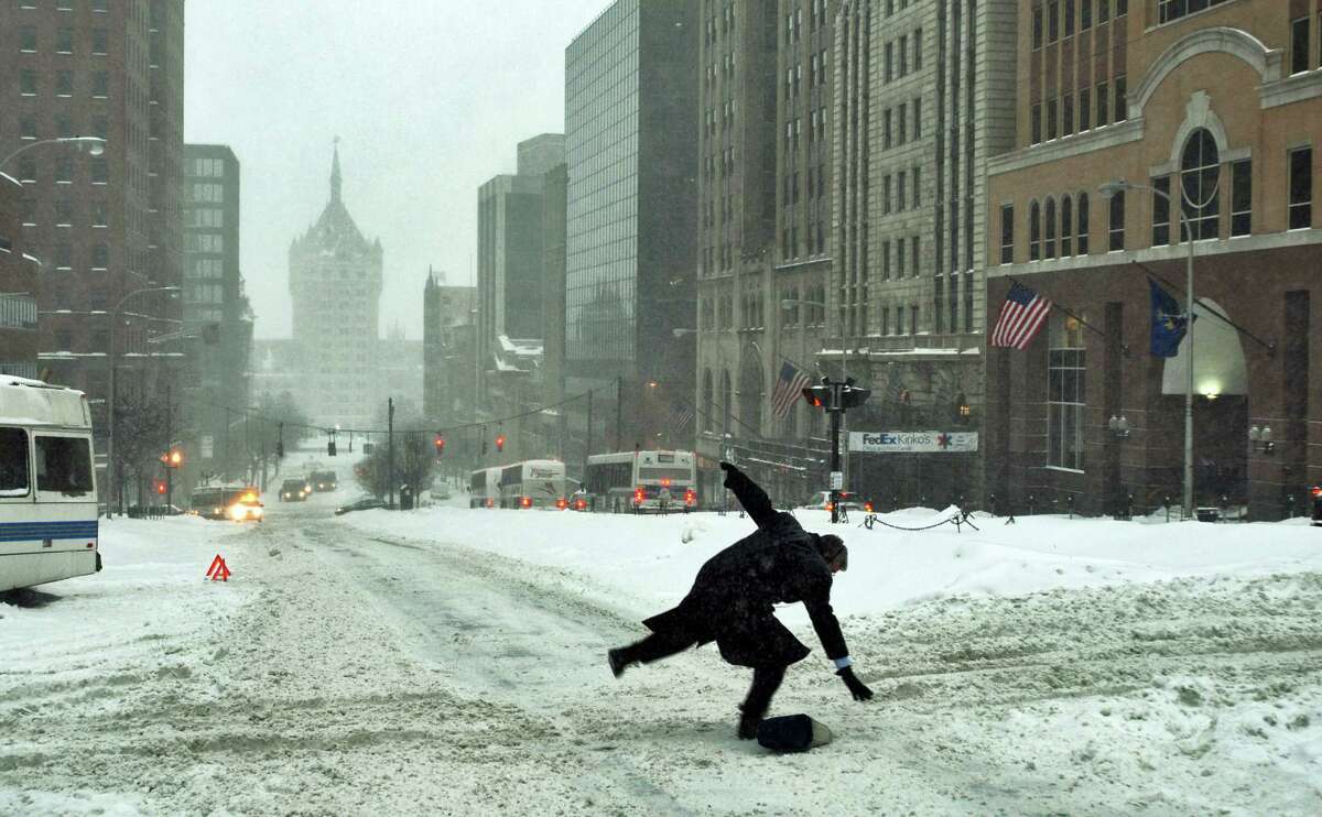 Feb. 14, 2007: A pedestrian slips and falls on icy State Street at Lodge Street in Albany on Feb. 14, 2007.