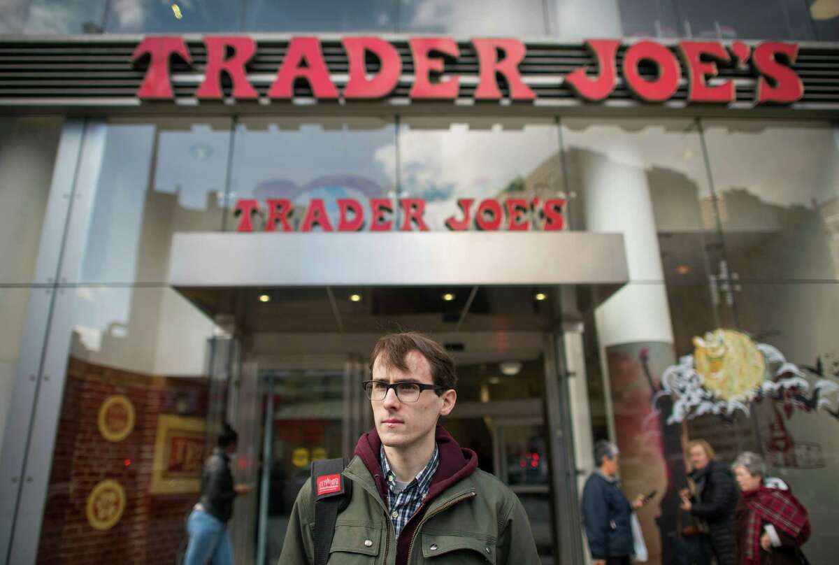 Thomas Nagle is outside the Trader Joe's in New York where he was fired. Employees of the grocery chain are complaining of harsh treatment by managers and a pressure to appear happy. despite the atmosphere they work in. (Joshua Bright/The New York Times)