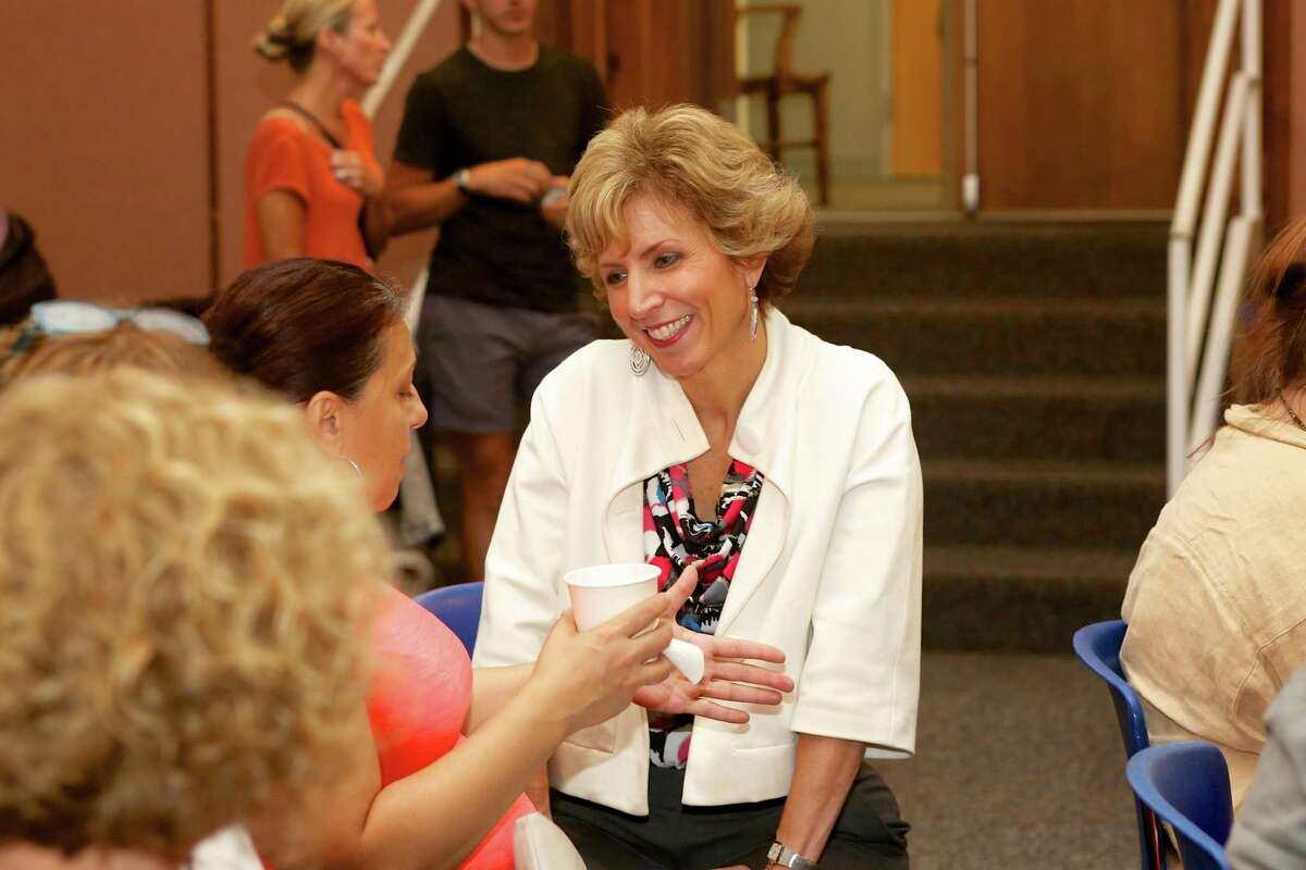 Dr. Lynn Toper, Chief of Specialized Learning and Student Services, speaks to a parent during a meeting held by the Norwalk Special Education Department at City Hall September 19, 2016..