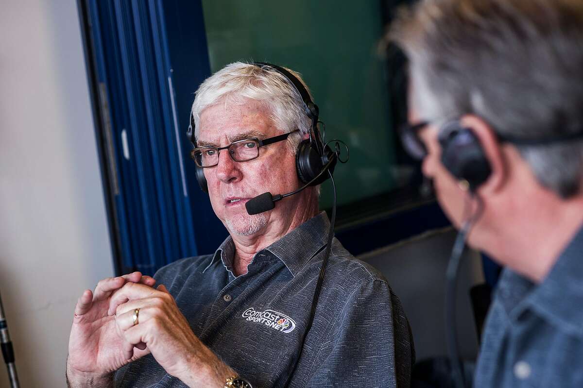 Giants announcer Mike Krukow leans on his service dog, Patriot, for support