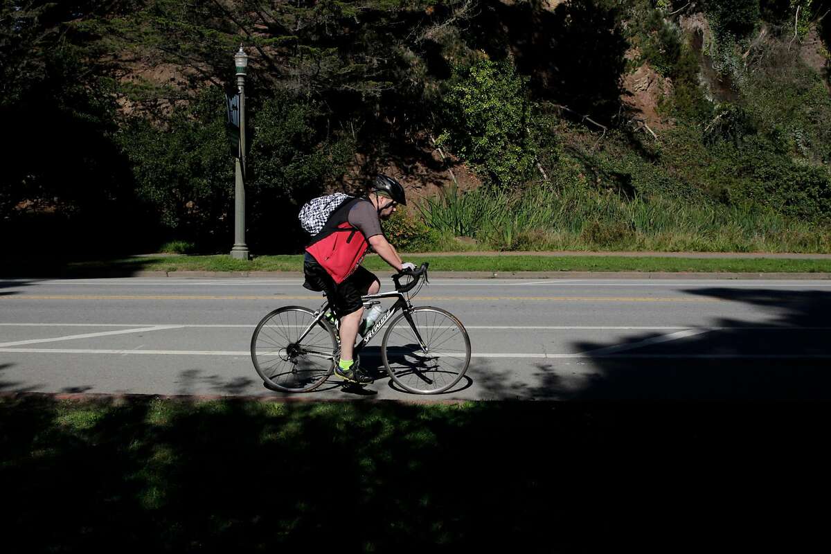 A pedestrian rides along John F. Kennedy Drive at Golden Gate Park on Friday, Oct. 21, 2016 in San Francisco, Calif. The Parks and Recreation department is planning to install nine speed bumps to reduce road deaths.