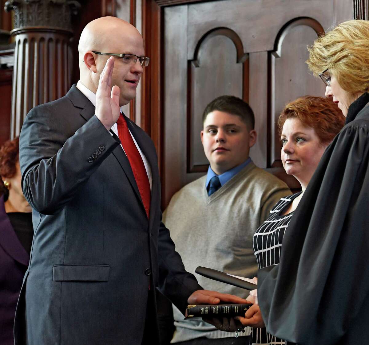 Rensselaer County District Attorney Joel Abelove, left, was sworn in on Jan. 1, 2015, by County Judge Debra Young as family members watched at the Rensselaer County Courthouse in Troy, N.Y. (Skip Dickstein/Times Union archive)