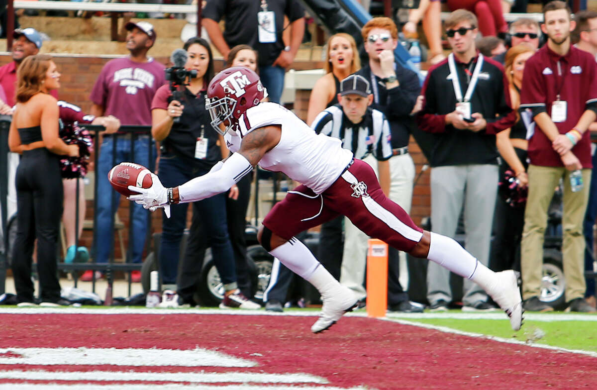 STARKVILLE, MS - NOVEMBER 5: Defensive back Nick Harvey #1 of the Texas A&M Aggies intercepts a pass in the end zone during the first half of an NCAA college football game against the Mississippi State Bulldogs at Davis Wade Stadium on November 5, 2016 in Starkville, Mississippi.