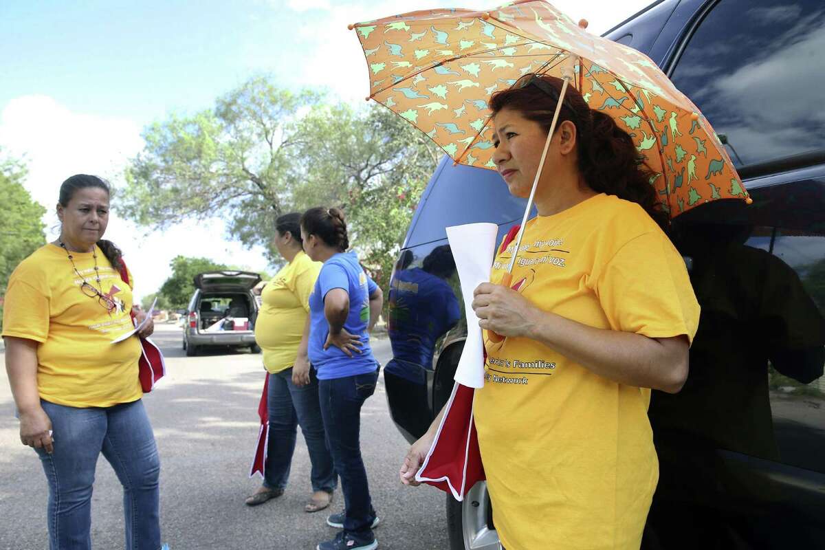 Delia Villa takes a break from the heat as canvassers for ARISE walk the neighborhoods in Pharr, knocking on doors, encouraging people to get out and cast their votes on November 3, 2016.