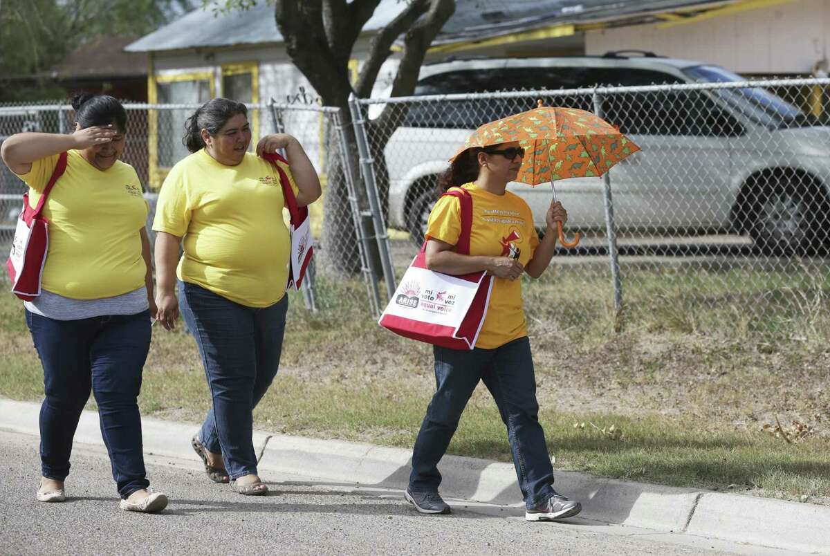 ARISE canvassers Bernice Estrada (from left), Eva Soto and Delia Villa walk the neighborhoods in Pharr, knocking on doors, encouraging people to get out and cast their votes on November 3, 2016.