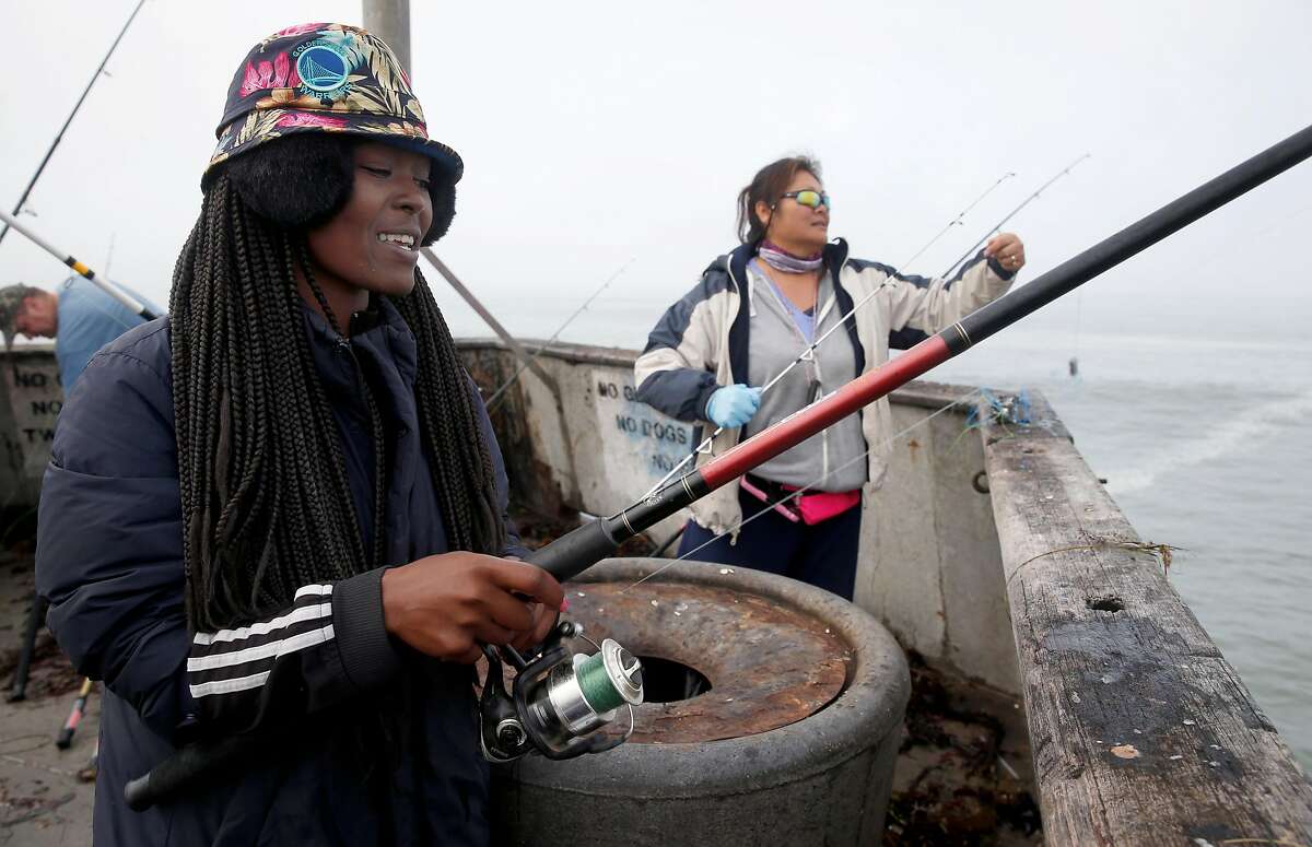 Evelyn "Muffin" Strauter goes crabbing on the municipal pier with Connie Seers (right) during the first day of the recreational Dungeness crab season in Pacifica, Calif. on Saturday, Nov. 5, 2016. Despite all of the enthusiasm, veteran crabbers say conditions were less than ideal as heavy surf continually pounded the pier.