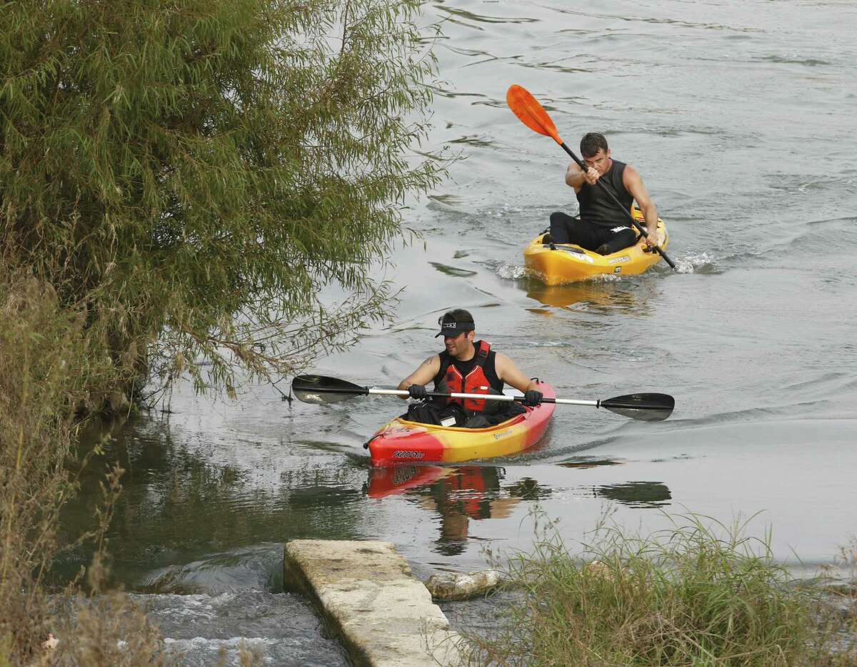 Kayaker' maneuver as the get close to the finish line at Mission County Park as San Antonio River Foundation holds its River Relay -- a combined 5K run and 4K kayak race, in conjuction with the San Antonio River Authority's 8th annual "Get Outdoors" event -- nature and fitness demonstrations, health screenings and other family friendly activites on Saturday, November 5, 2016.