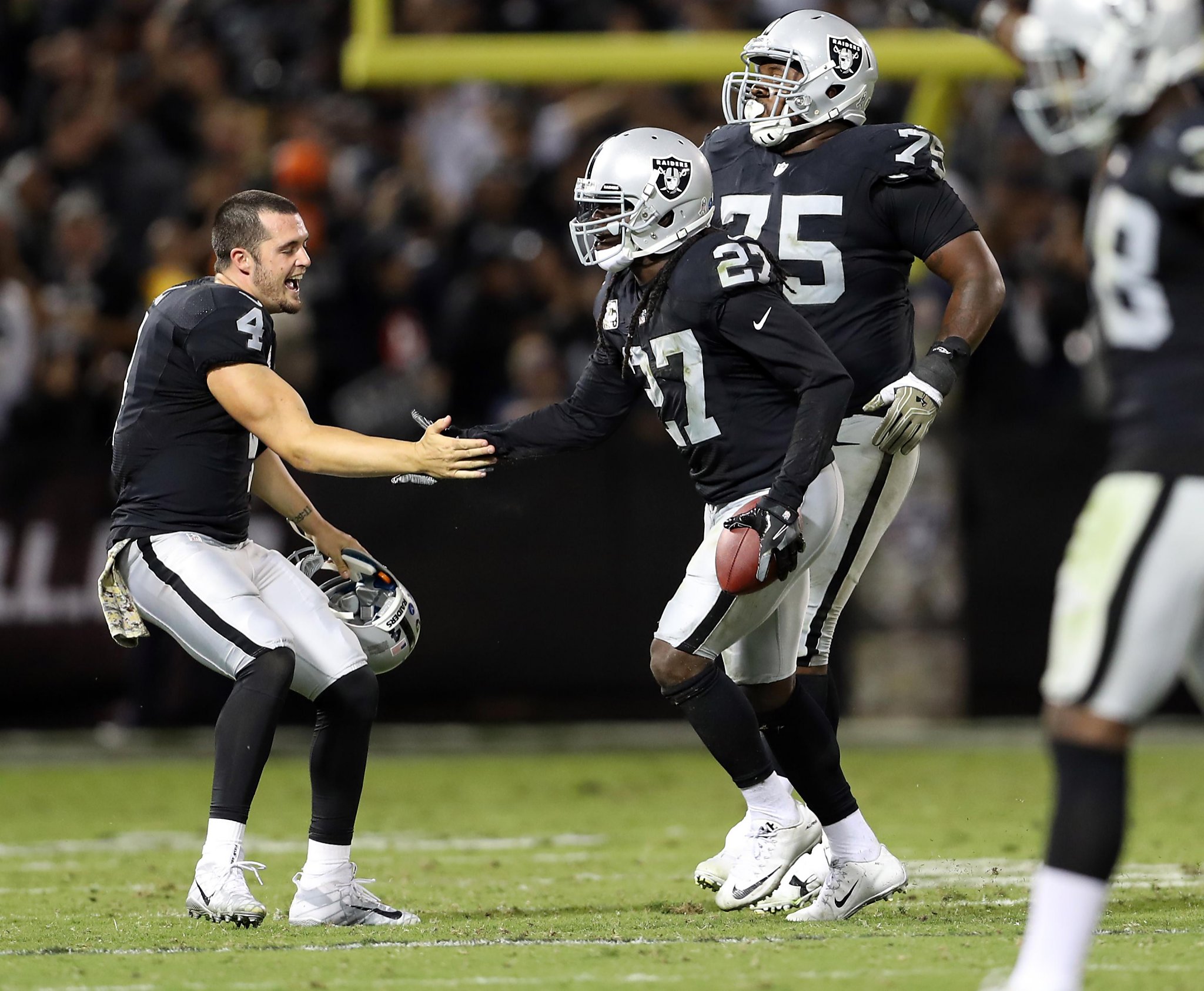 Oakland Raiders Reggie Nelson (27) celebrates intercepting pass