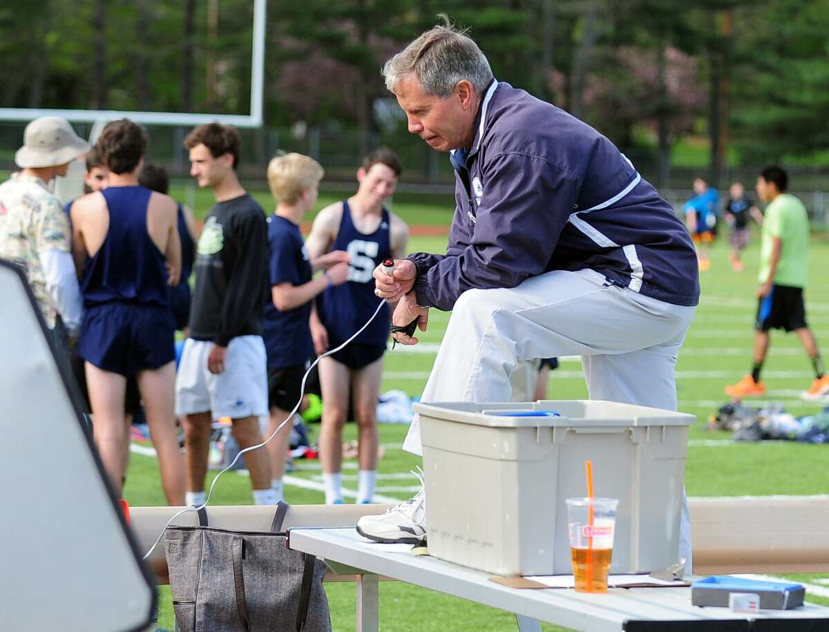 Staples' Track Coach Laddie Lawrence, during boys track action against Westhill and Trumbull in Trumbull, Conn. on Tuesday May 13, 2014.