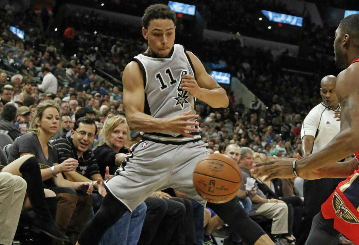 Bryn Forbes of the Spurs tries to save a ball from going out of bounds during against the New Orleans Pelicans at the AT&T Center on Oct. 29, 2016 in San Antonio.